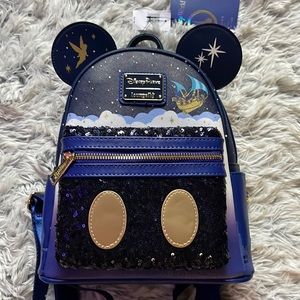 Disney park exclusive Peter Pan loungefly main attraction collection.